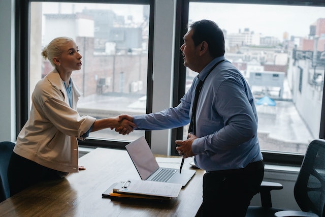 property manager shaking hands with new client